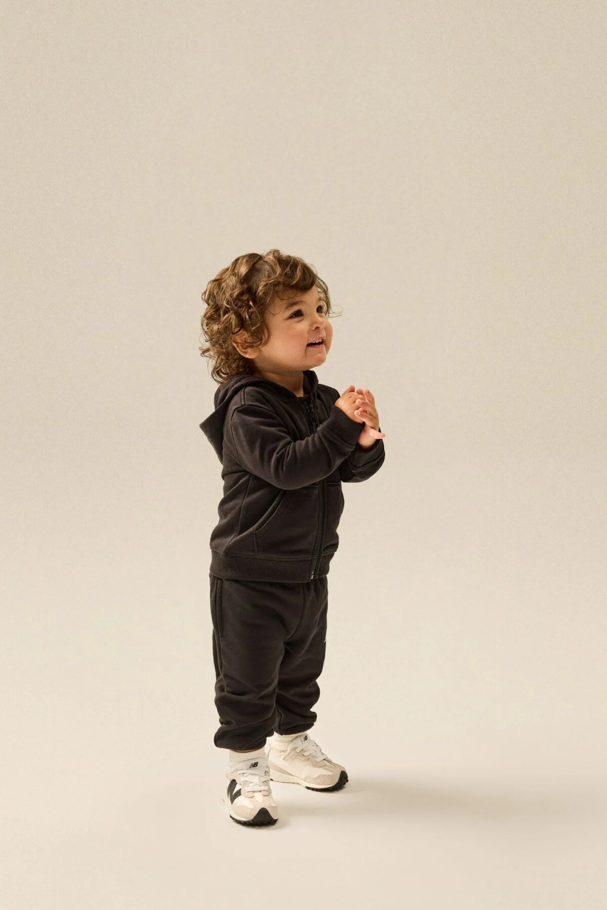 Small child standing in a matching clothing set